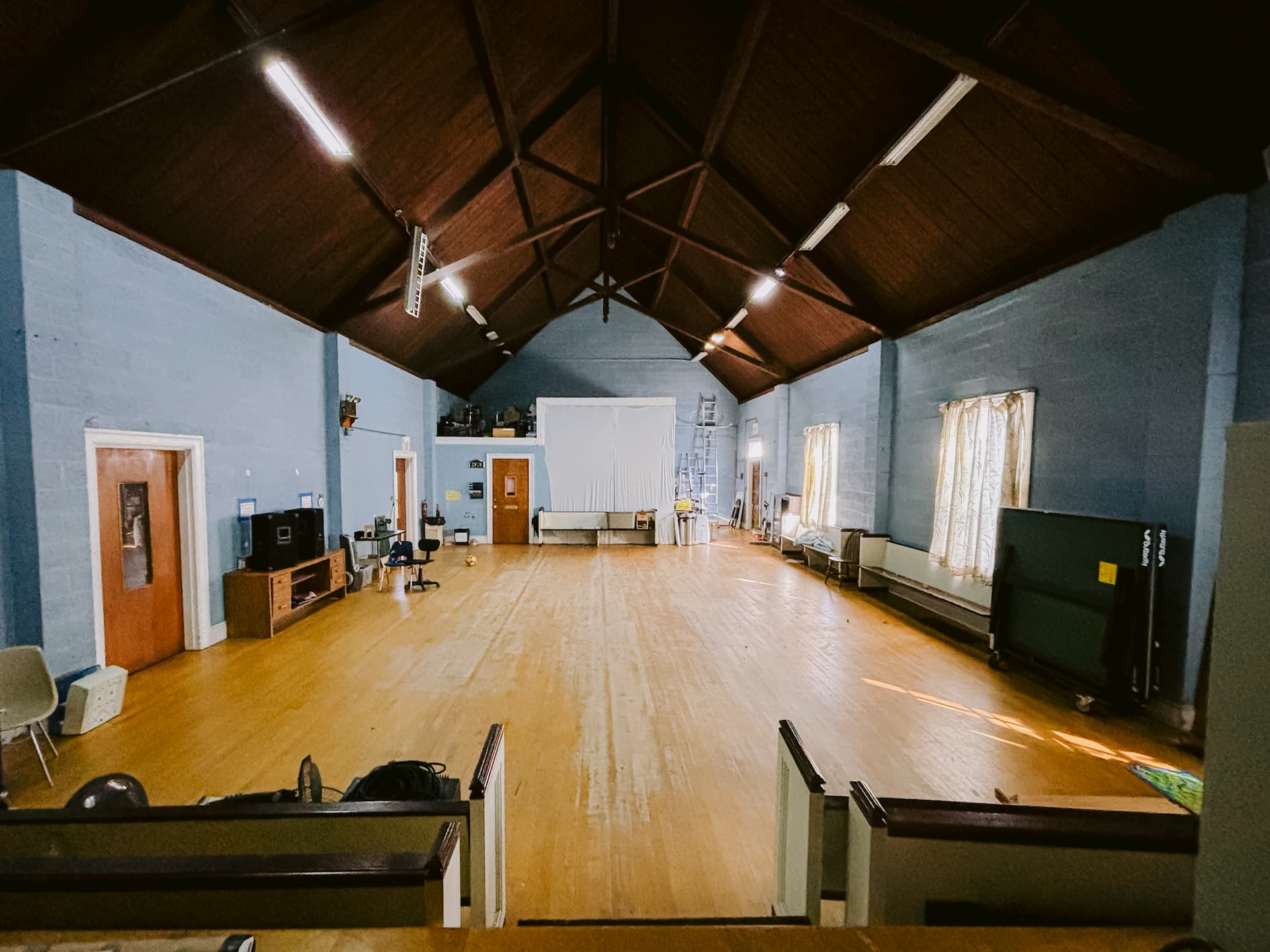 Auditorium rear view showing wood ceiling and open floor