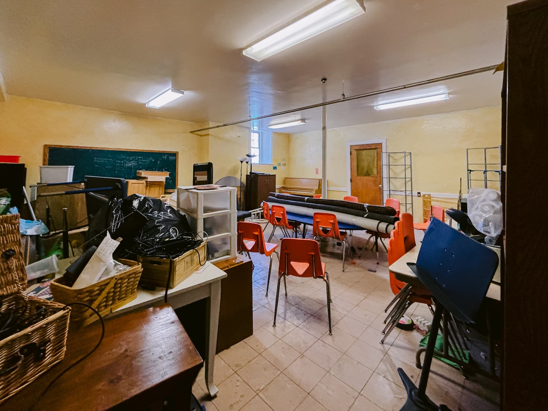 Current classroom with orange chairs