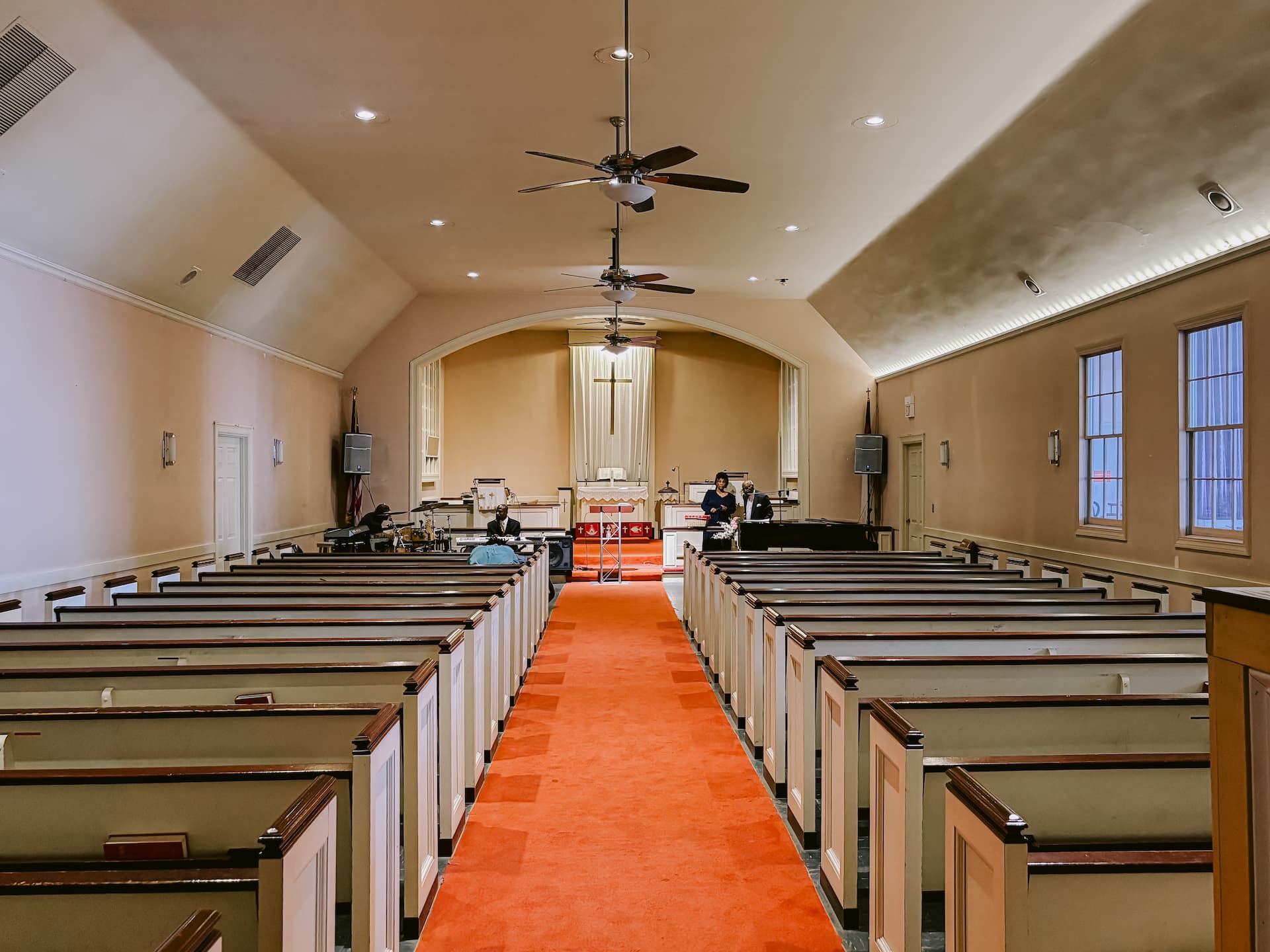 Sanctuary center aisle with pews and raised worship area